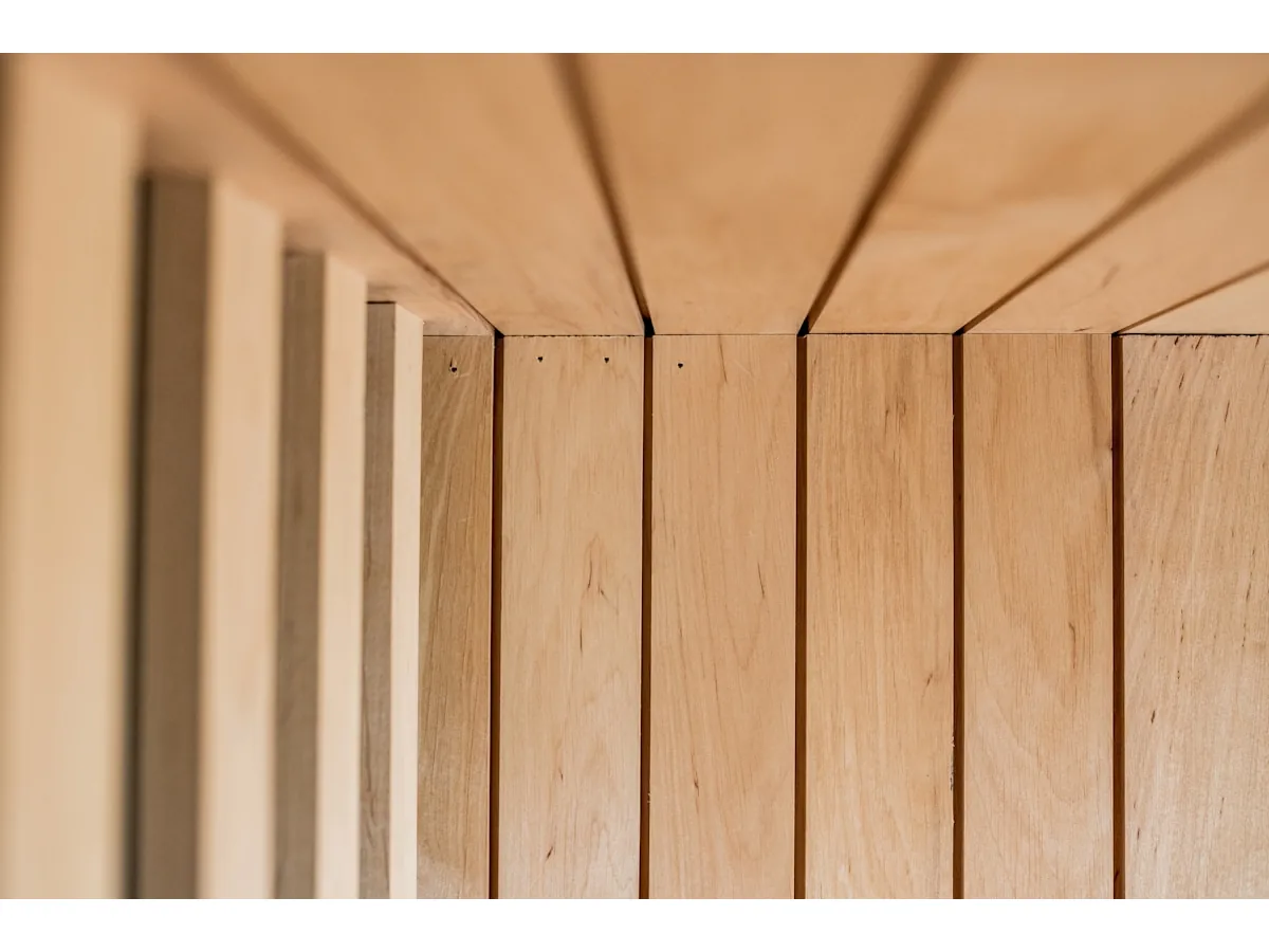 Close-up of precision pale oak wood slats with mitre joints — modern joinery detail
